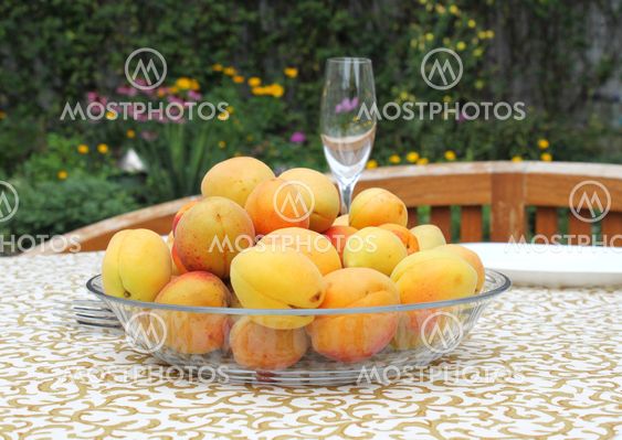 Apricots in a bowl on the table.
