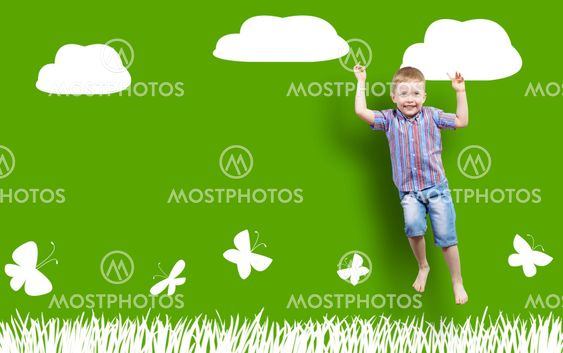 boy jumping on the background of painted wall