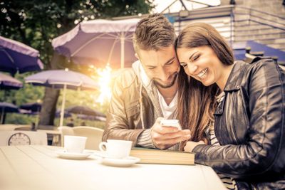 Couple taking a selfie in a bar