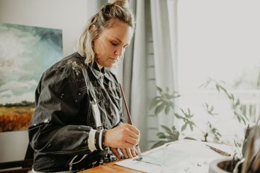 Art, painting and woman in studio at desk for drawing,...