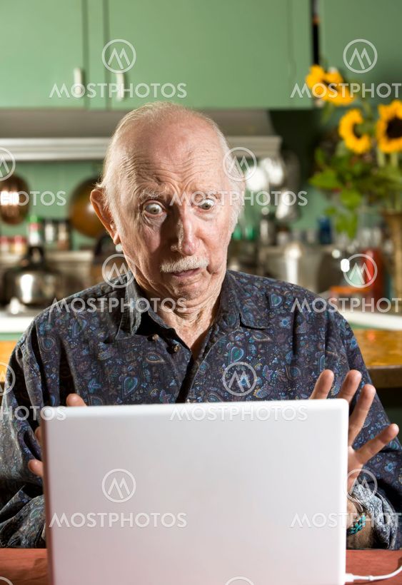 Shocked Senior Man with a Laptop Computer