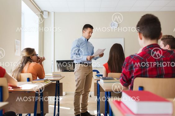 group of students and teacher with test results