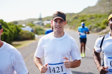 Portrait, man and running marathon in road for fitness...