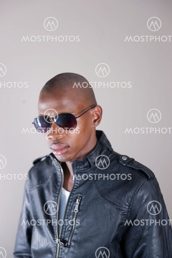 Trendy African man in leather jacket