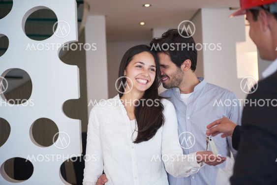 couple buying new home with real estate agent