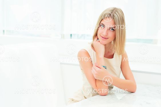Portrait of a cute woman in a city cafe