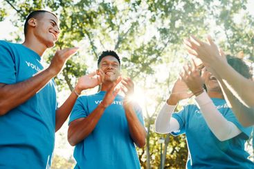 Volunteer, team or people clapping for celebration,...