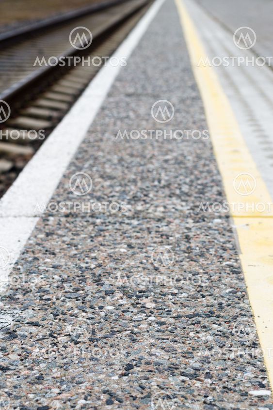 Pattern perspective view at the edge of platform to warn of the railway lines