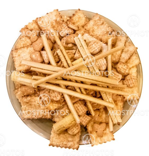 Round plate with cookies and waffles isolated on white