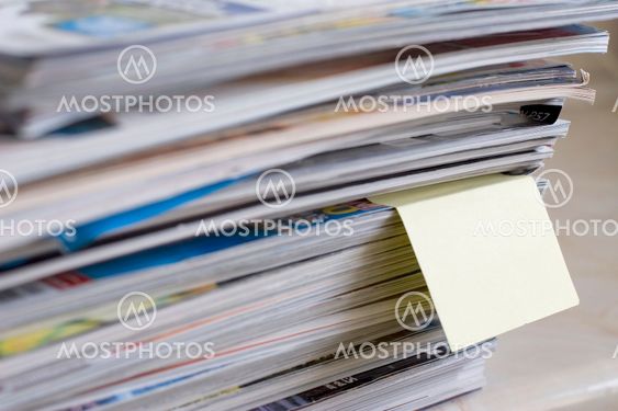 magazines with post it note