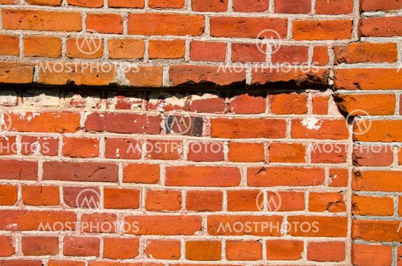Background of red brick wall fragment.