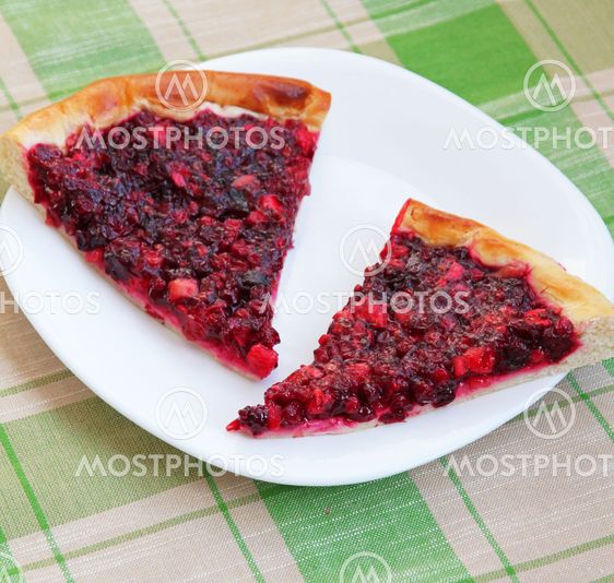 Two pieces of apple and cowberry jelly pie