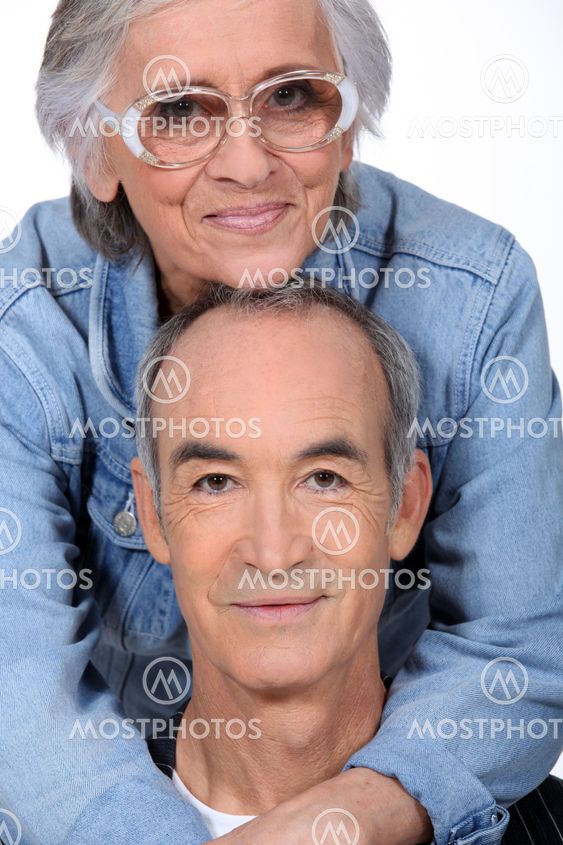 Elderly couple hugging