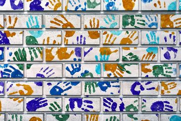 Hand shapes marked on a wall with paint