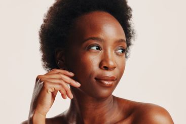 Beauty, skincare and glow with black woman in studio for...