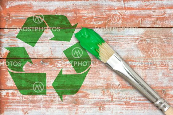 Recycle symbol painted on the wooden wall