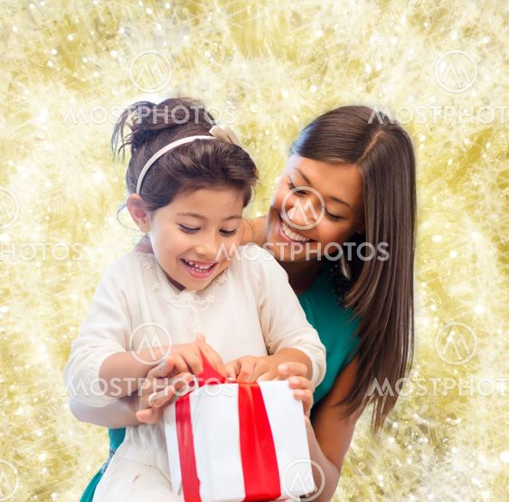 happy mother and little girl with gift box