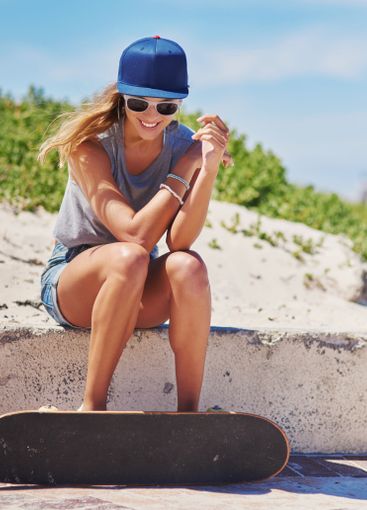 Girl, sunglasses and happy outdoor with skateboard for...
