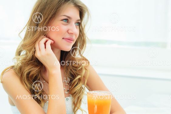 Portrait of a cute woman in a city cafe