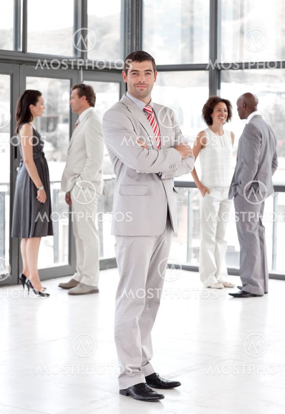 portrait of a latin manager leading his team