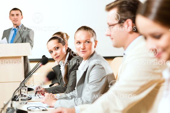 businessmen communicate at the conference