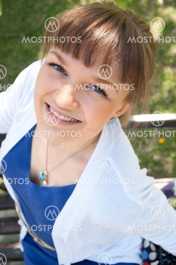 portrait of a beautiful woman in summer park