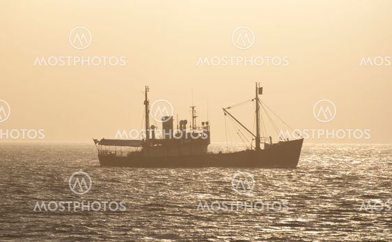 Small Boat in Evening Mist
