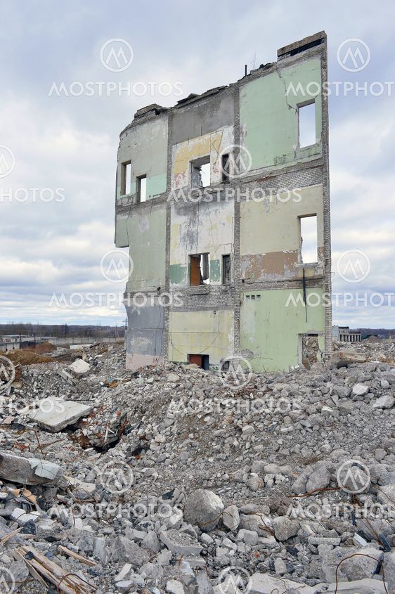 Pieces of Metal and Stone are Crumbling from Demolished...