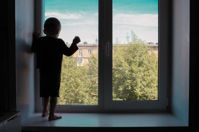 Child without parents concept. The child looks out