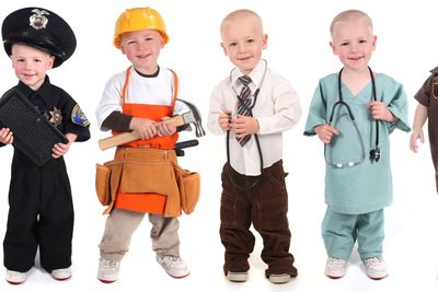 Boy Wearing Various Occupational Uniforms