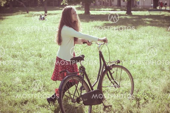 vintage eastern hipster woman with bike