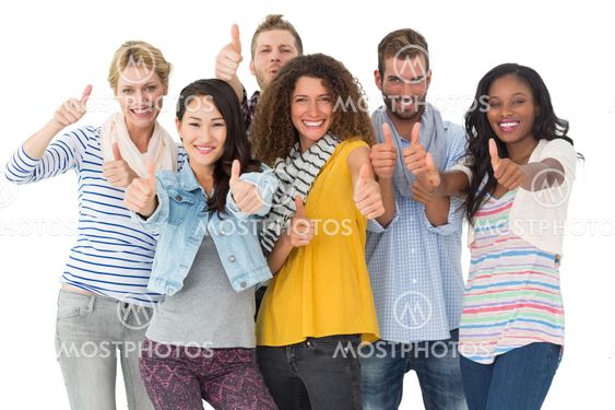 Happy group of young friends giving thumbs up to camera