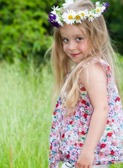 Cute little girl with floral wreath