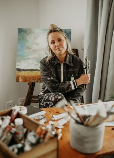 Paintbrush, art and portrait of woman in painting studio...
