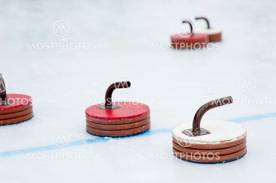 Curling stones on the ice