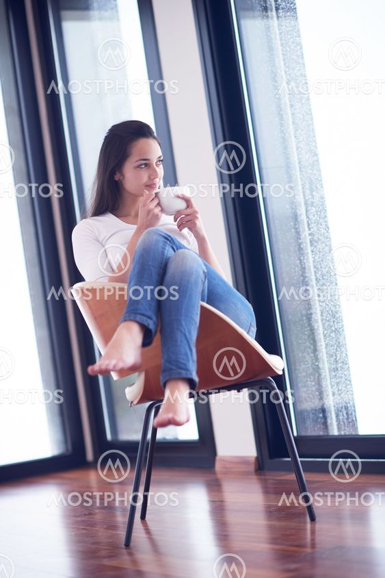 beautiful young woman drink first morning coffee