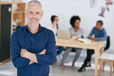 Portrait, employee and mature man with arms crossed, joy...