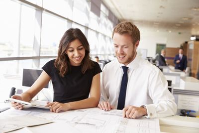Two young architects working together in an office