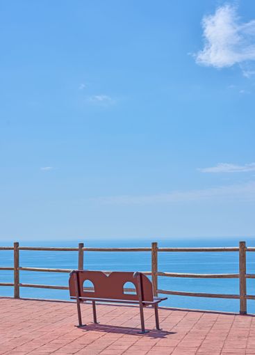 Bench, ocean view and outdoor travel to sea, tourism and...