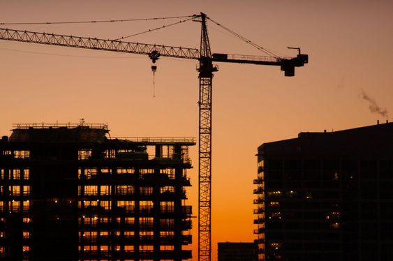 Silhouette of Crane and Building