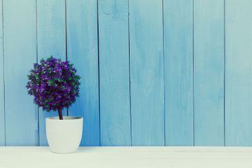 Wooden items of home decor close up on blue wooden...