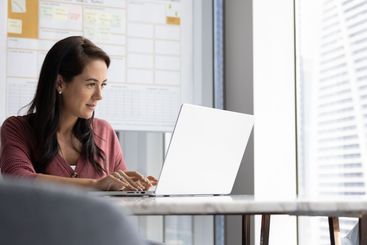 Positive focused engaged Latin business leader woman...