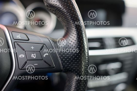 Steering wheel of car, details of phone adjustment controls