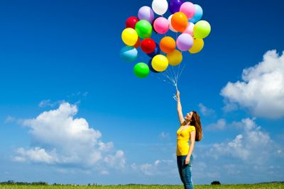 Girl with colorful balloons