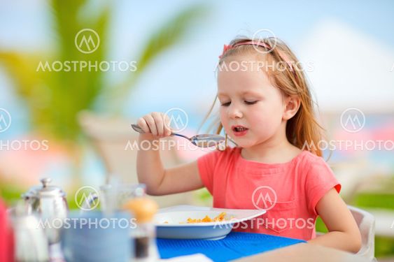 Little girl eating breakfast