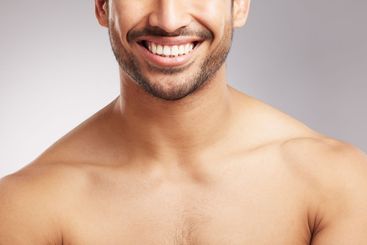 Dental care, mouth and man with smile in studio for...