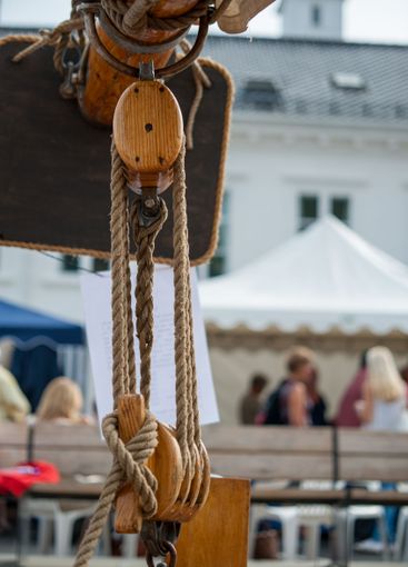 wooden pulley and rigging on a traditional sailing vessel.