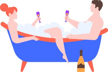 Romantic couple relaxing in a luxurious bathtub filled...