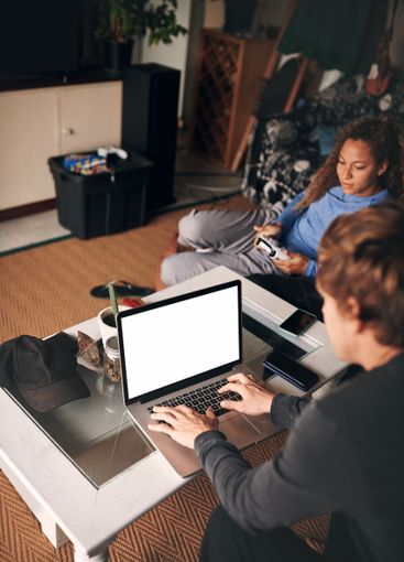 Couple, man and laptop for remote work in home, console...