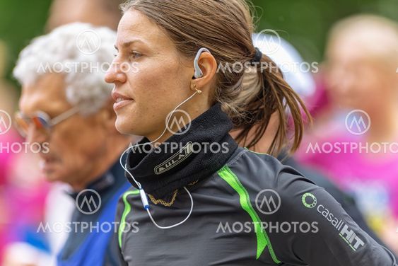 Closeup of a woman with earplugs in ASICS Stockholm...